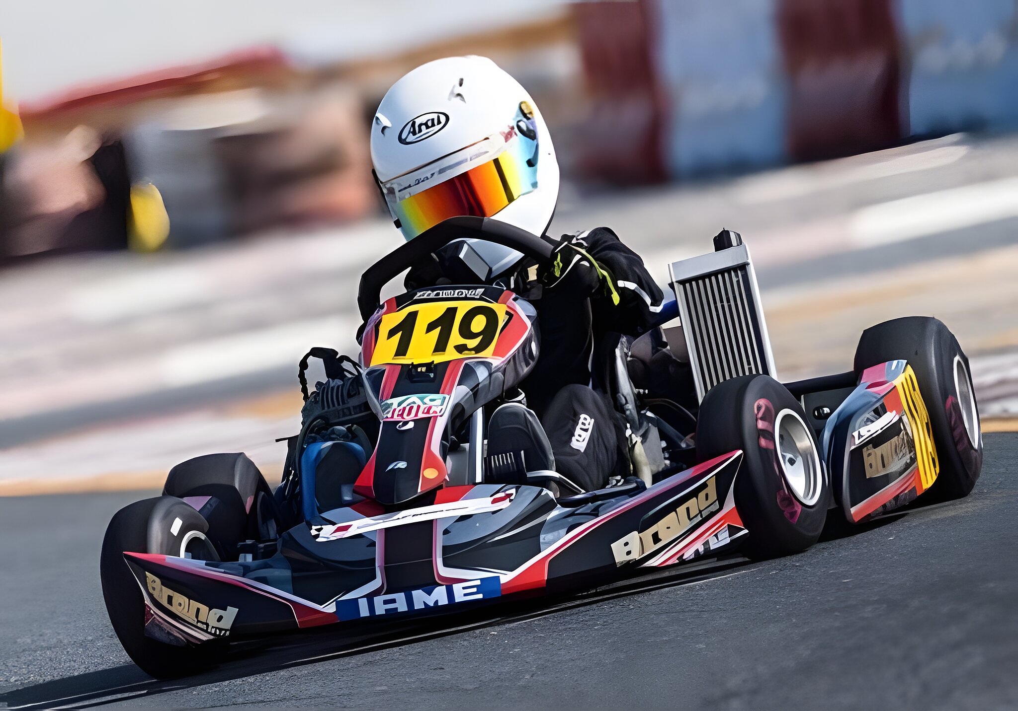 Kart 119 loaded up mid-corner, visor down