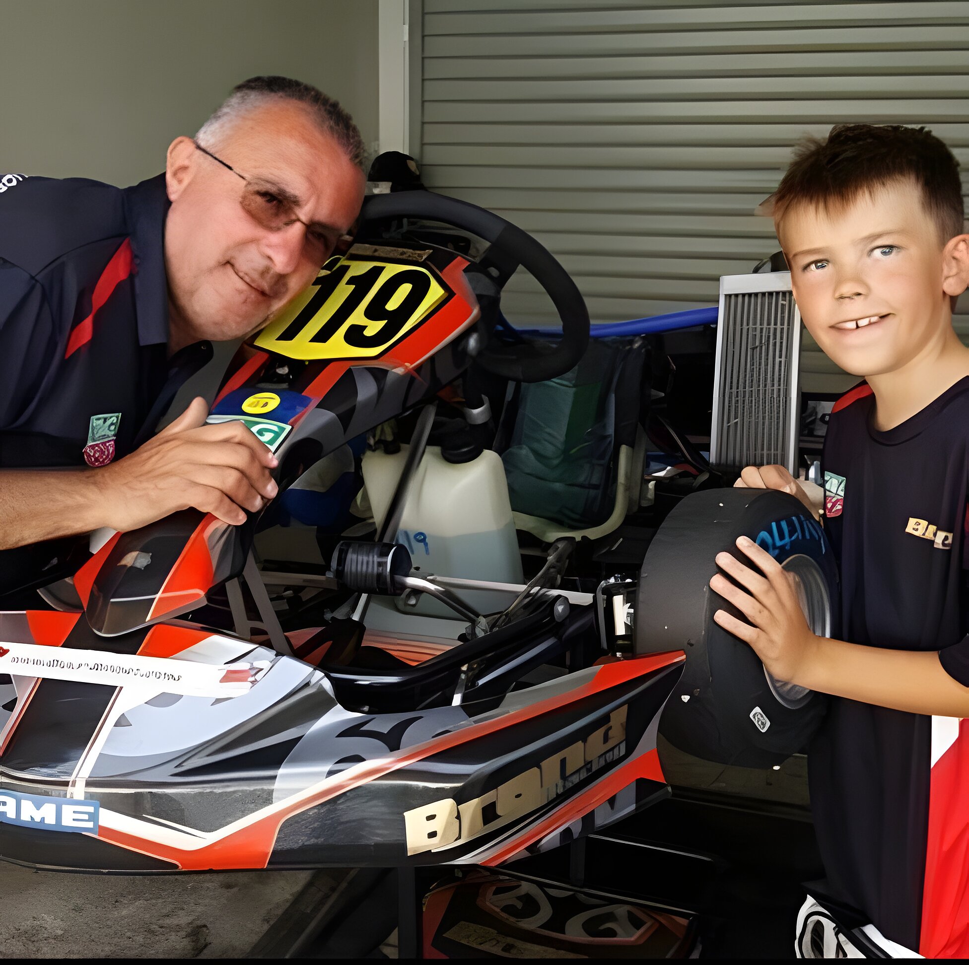 Thumbs up from the mechanic over the number 19 kart in the garage