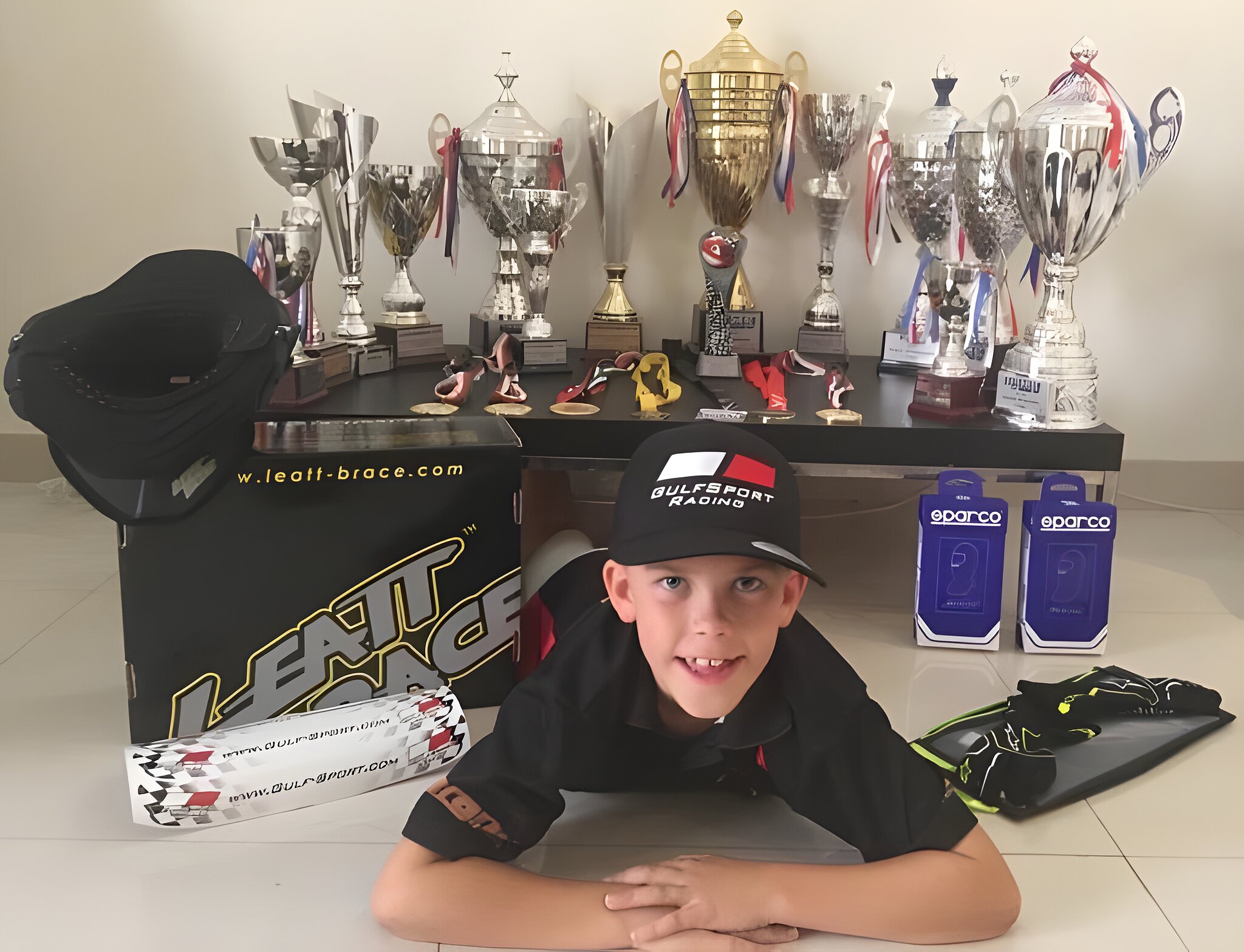 The trophy collection, lined up and outgrowing the shelf