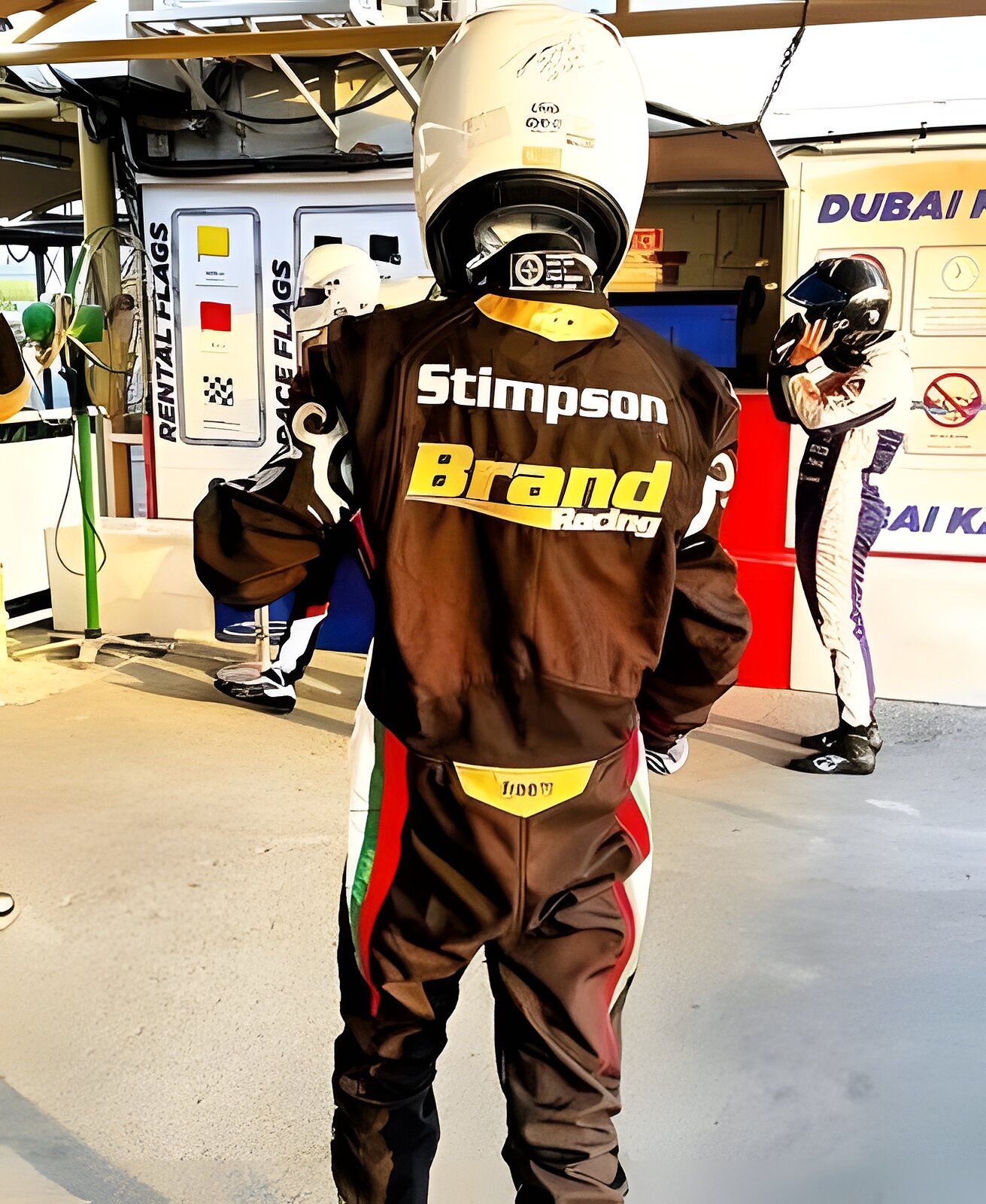 The back of the race suit: Stimpson, helmet already on, pit lane ahead